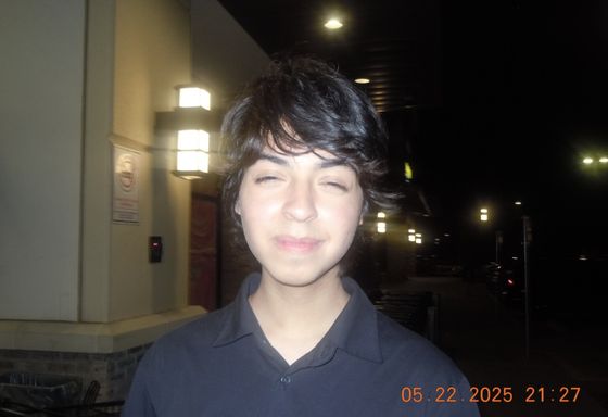 night flash photo of Ethan from a digital camera