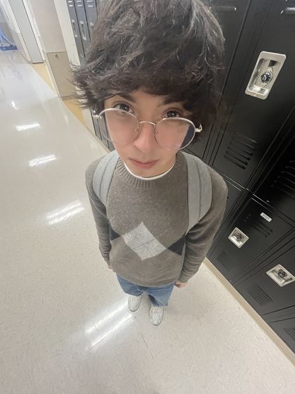 fisheye selfie of Ethan in a hallway lined with lockers