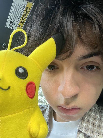 selfie with a Pikachu plush