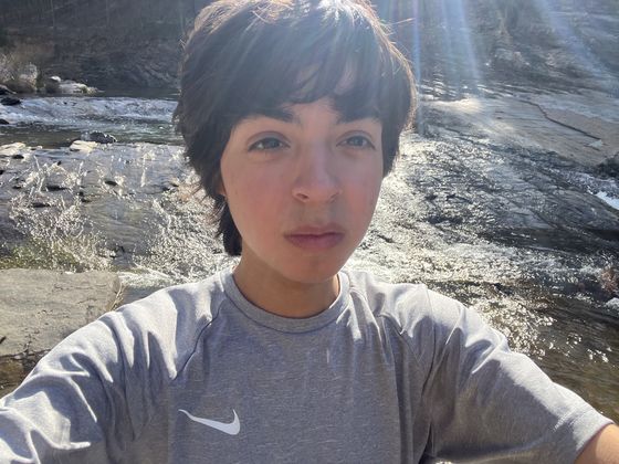 sunny selfie by a rocky river